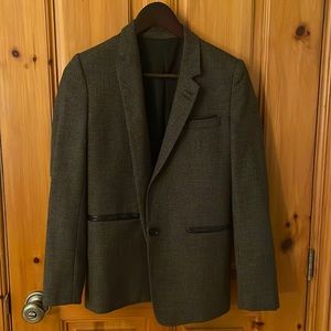 The perfect tweed blazer with leather elbow patches